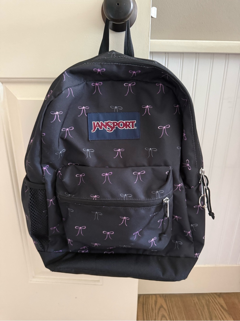 Jansport Black Backpack with Small Pink Bow Pattern